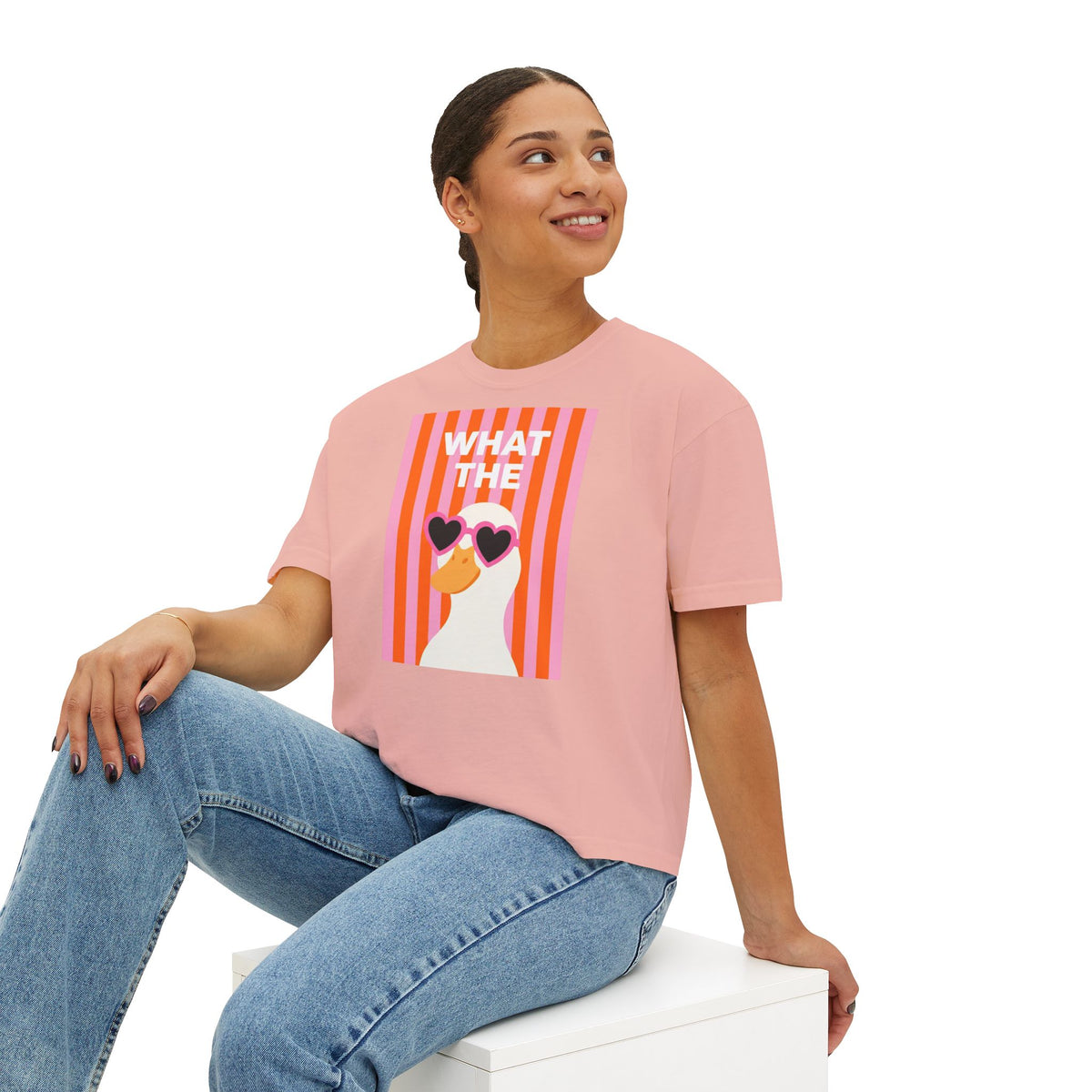 Women's pink boxy crop T-shirt with duck graphic front, worn with jeans
