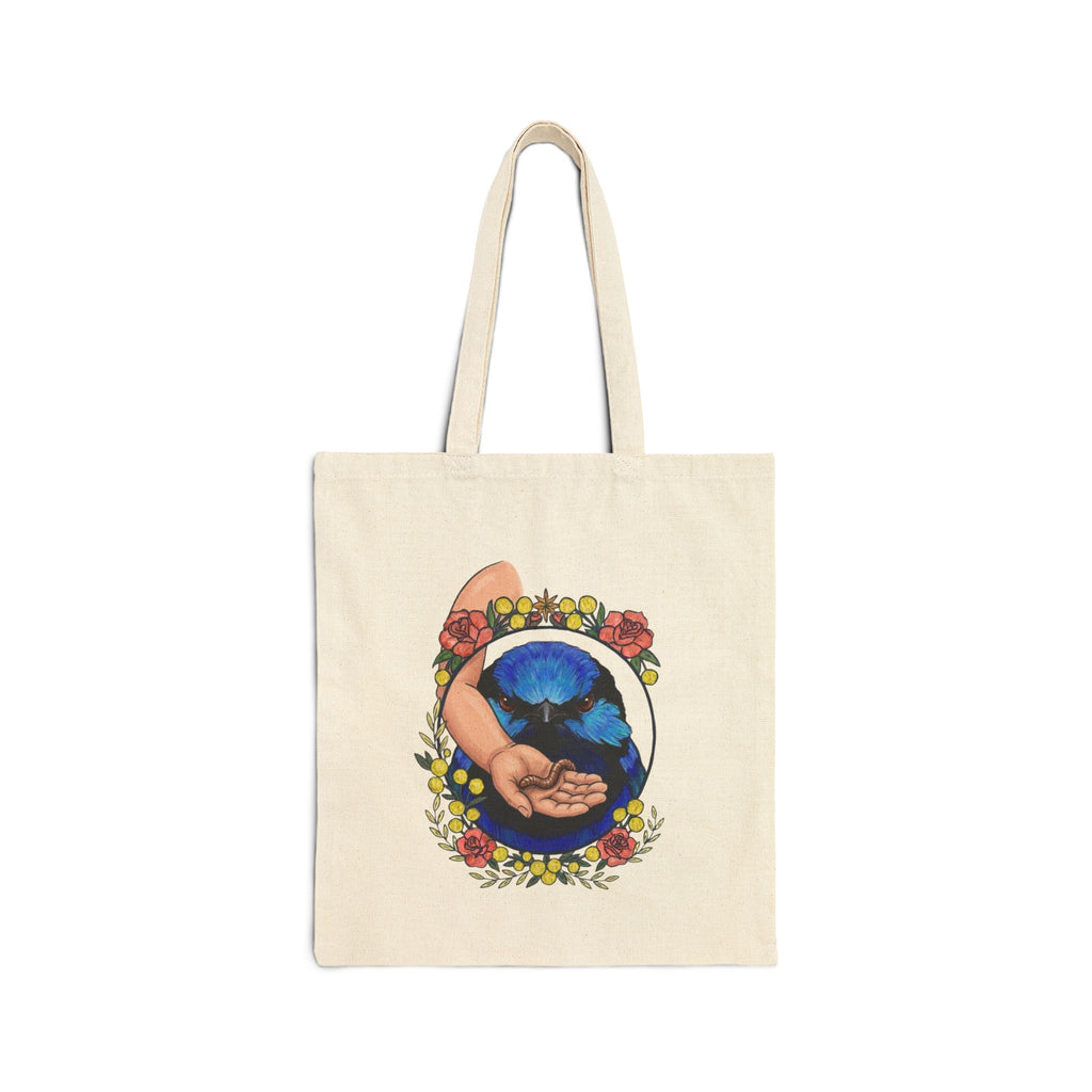 Natural canvas tote bag with blue-toned hand-and-grubs graphic on front