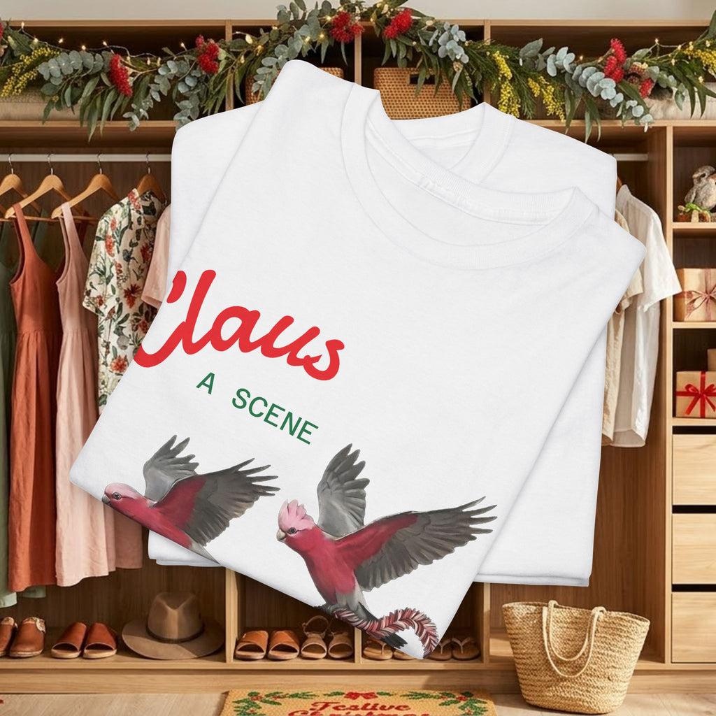 White Claus Christmas tee with large red “Claus” text and flying bird design