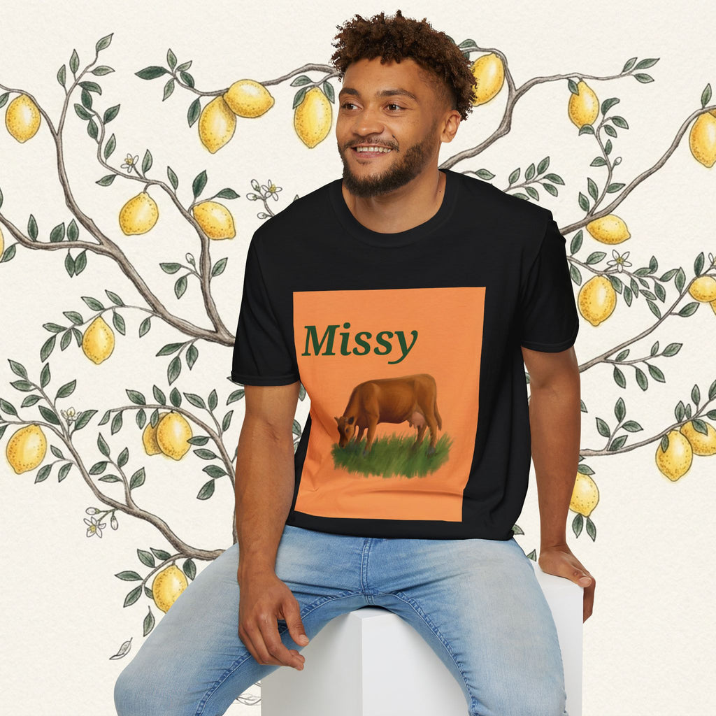 Black crew-neck T-shirt with orange 'Missy' panel and grazing cow illustration