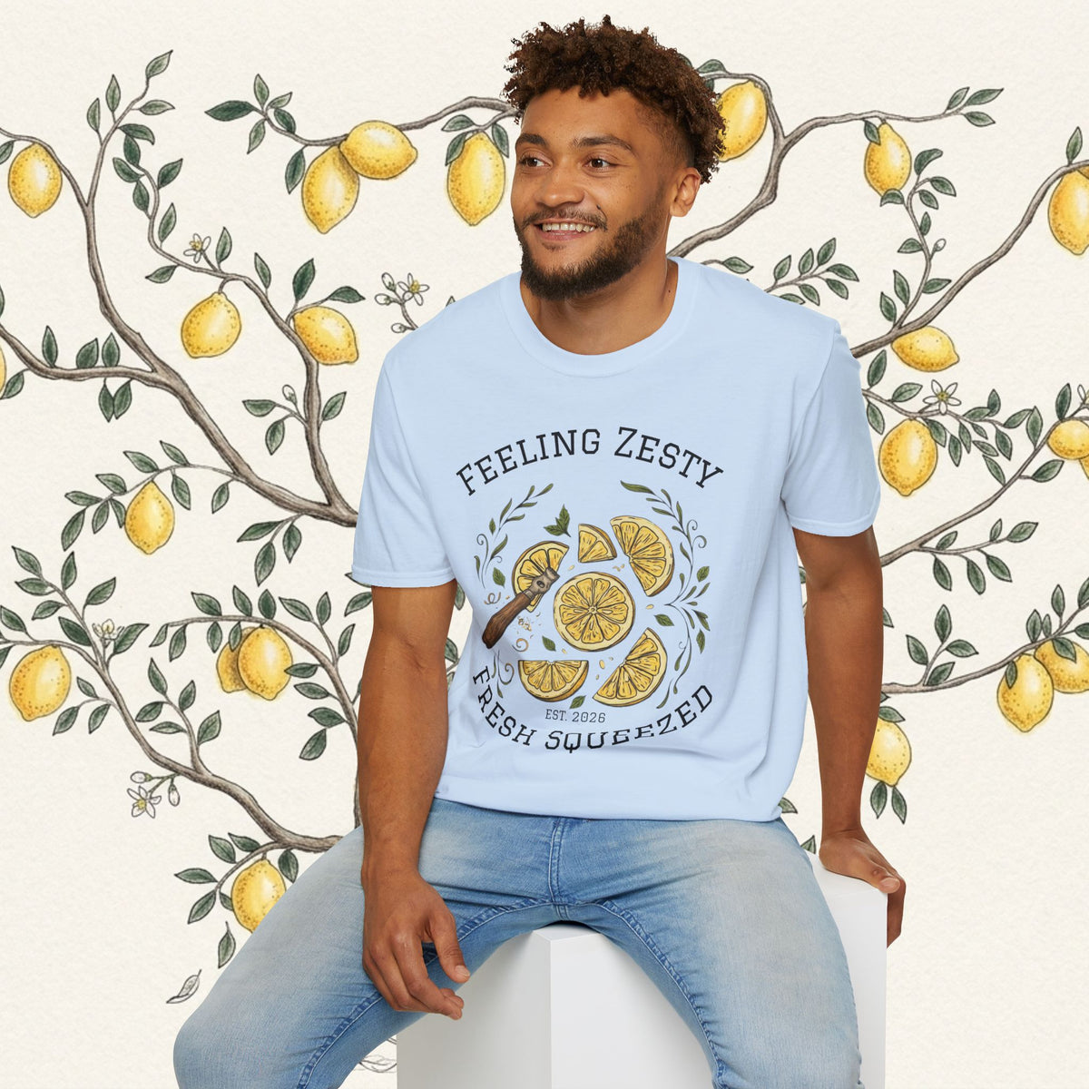 Light blue crewneck graphic tee worn with jeans, citrus slice design and "FRESH SQUEEZED"