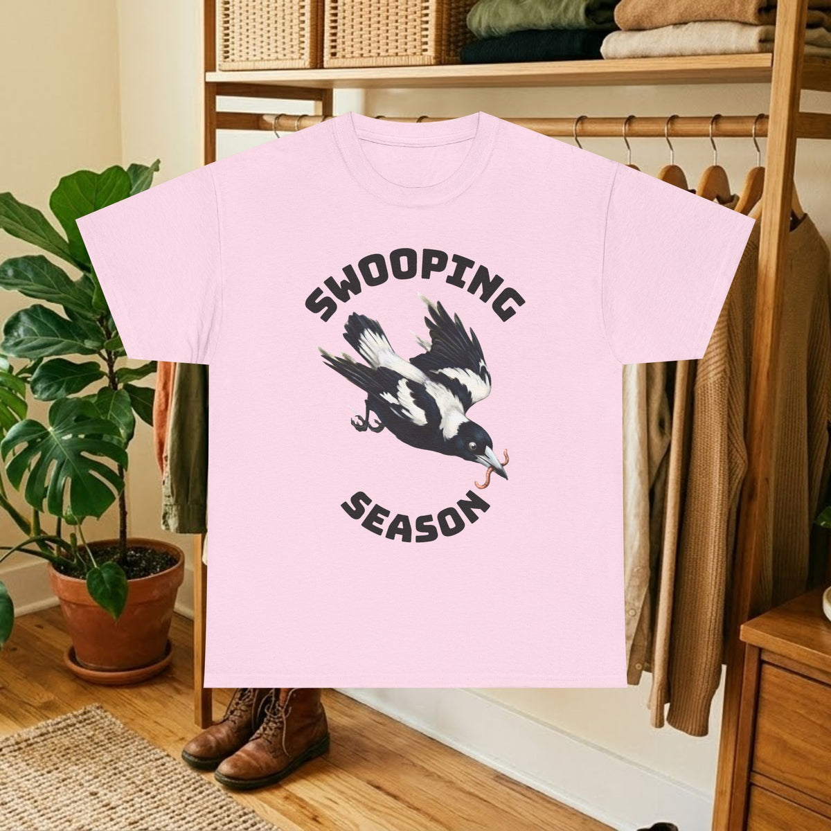 Light pink t-shirt with black bird graphic and "SWOOPING SEASON" text