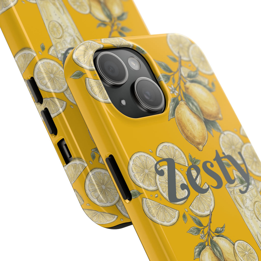 Close-up yellow tough phone case with citrus pattern; black camera lens covers.