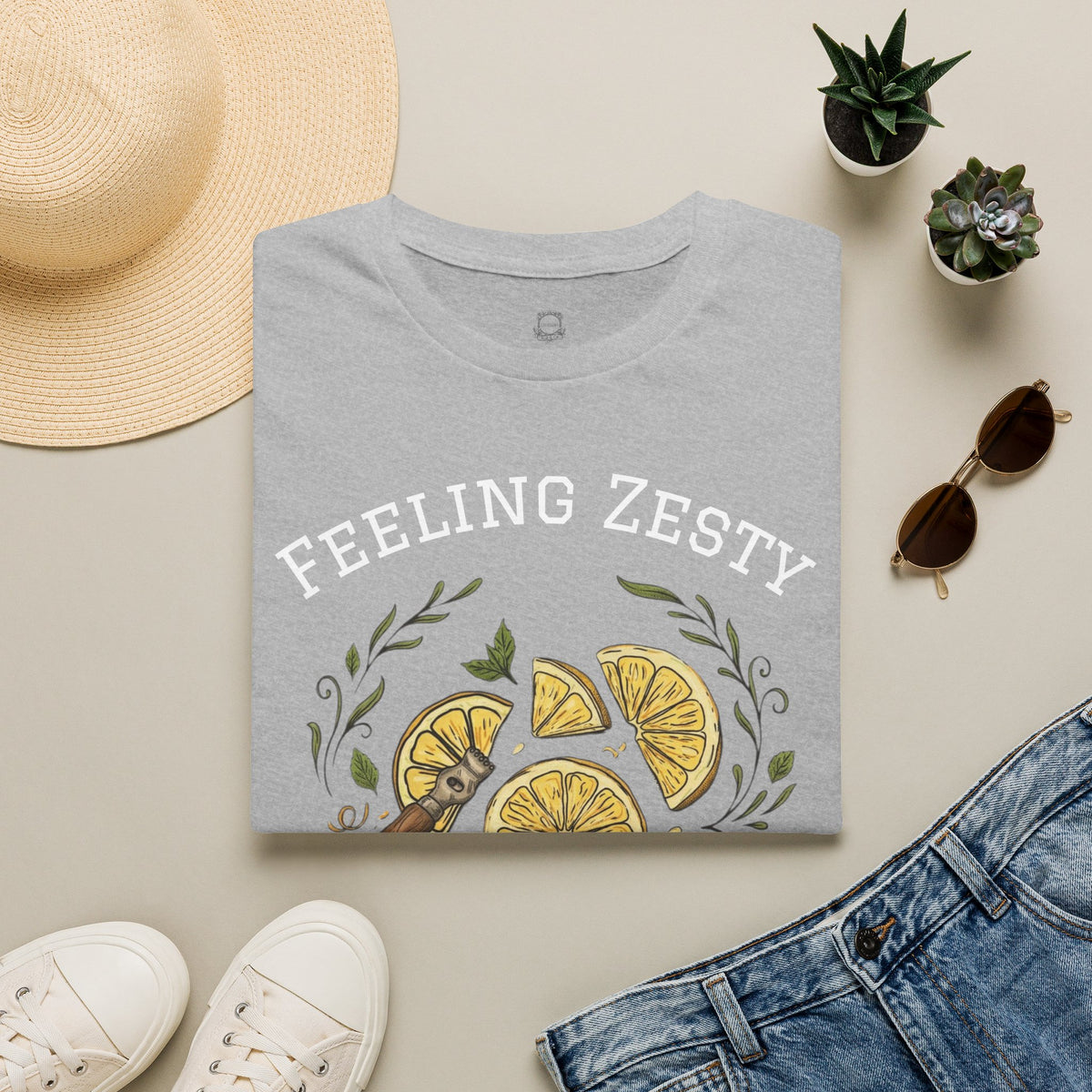 Light gray crewneck graphic tee, folded flat with lemon slice design