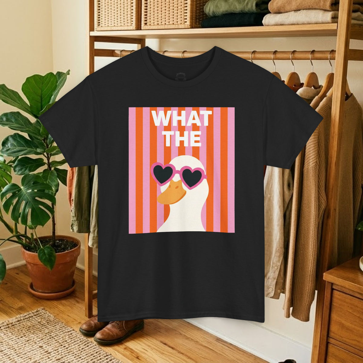 Black graphic cotton tee with "WHAT THE" heart sunglasses face graphic