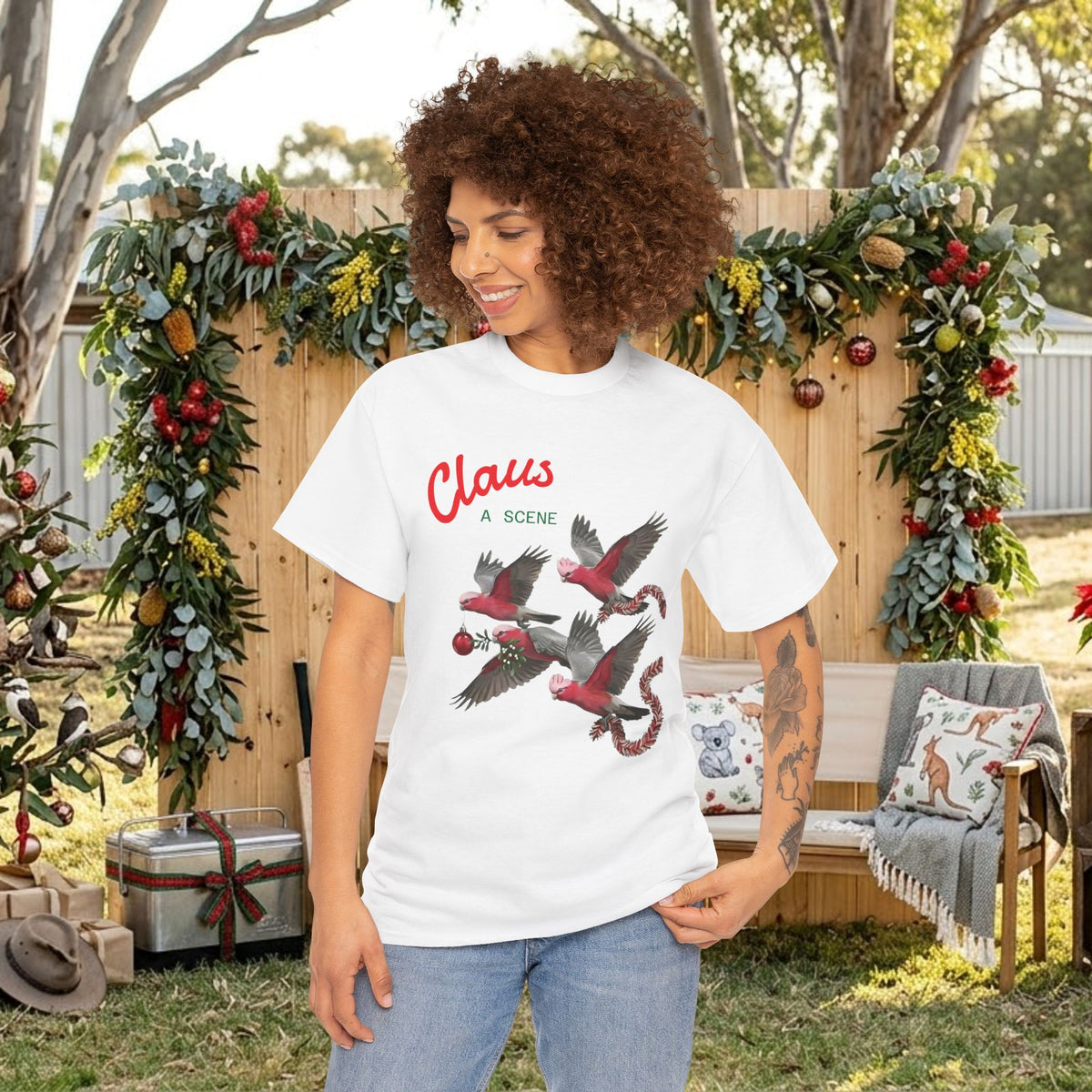 White Christmas T-shirt with “Claus” logo and red-and-gray flying bird graphic