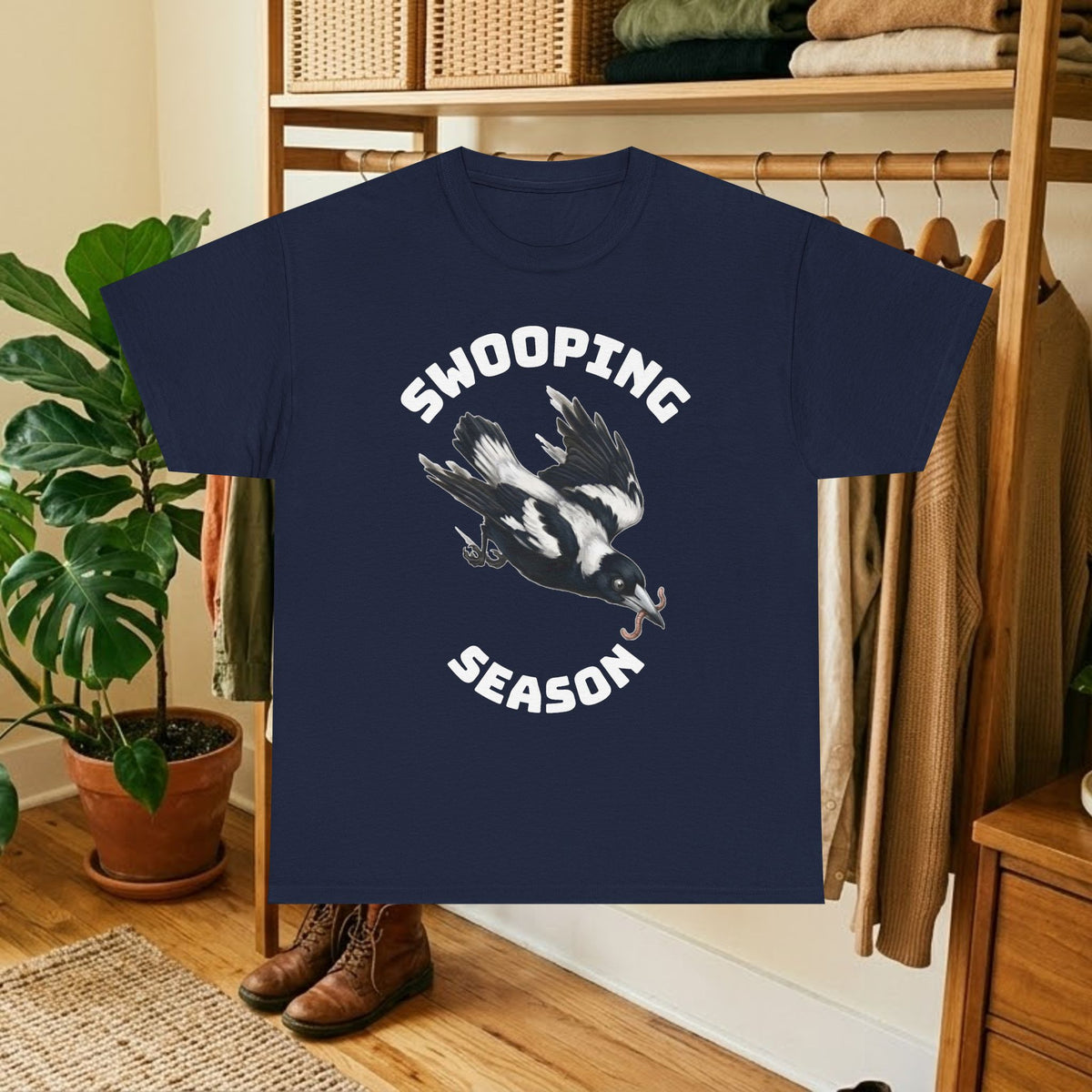 Navy t-shirt with black bird graphic and "SWOOPING SEASON" text