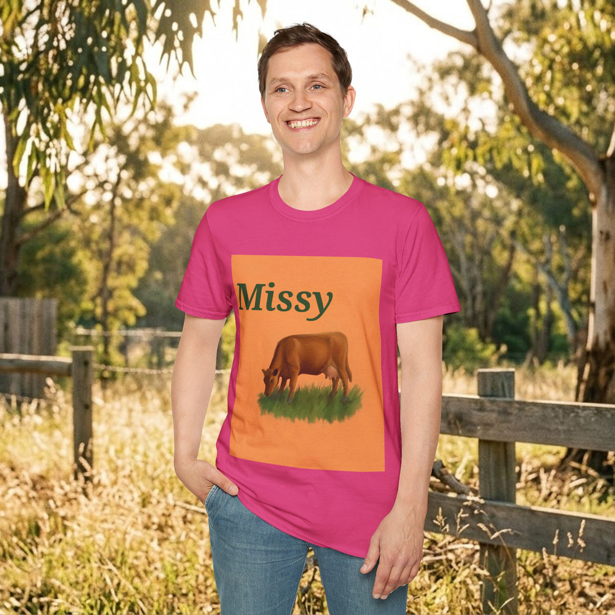 Pink crewneck t-shirt front view with orange cow graphic and “Missy” text