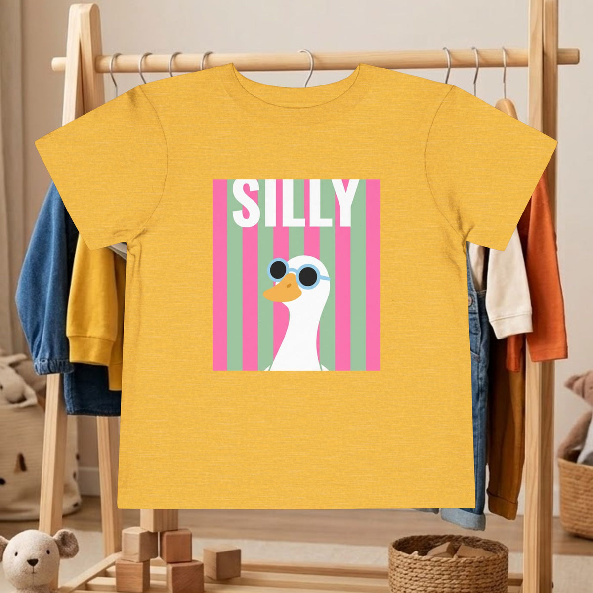 Yellow toddler graphic tee with pink 'SILLY' duck sunglasses square front print