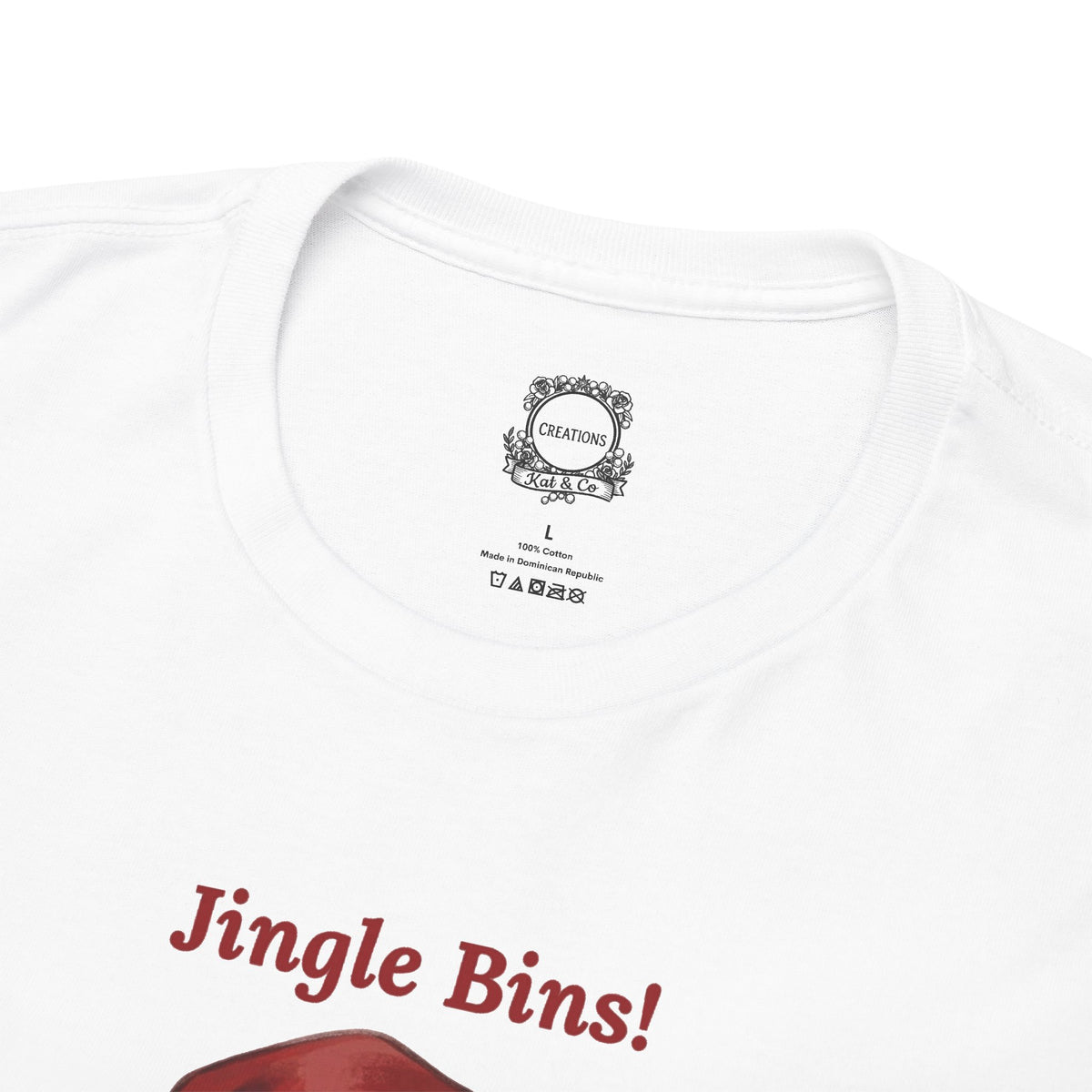 White graphic T-shirt neckline close-up with small crest and “Jingle Bins!” text.