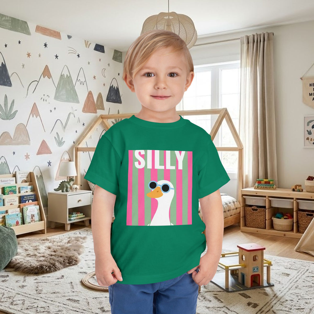 Green toddler T-shirt with colorful “SILLY” duck sunglasses graphic