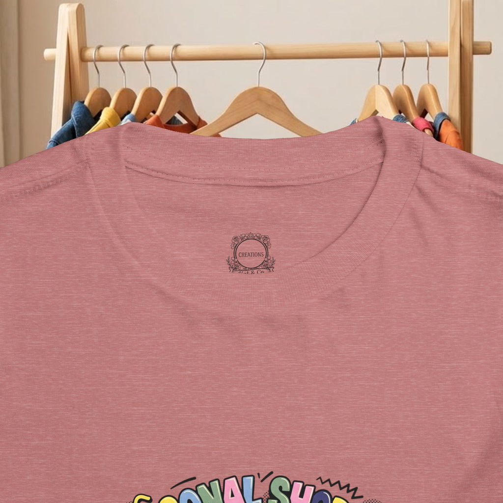 Maroon toddler tee close-up of neckline badge and partial bottom graphic