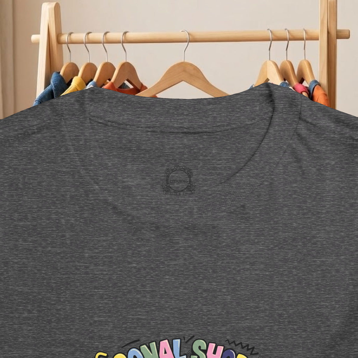 Dark gray toddler T-shirt close-up of crew neck and partial graphic