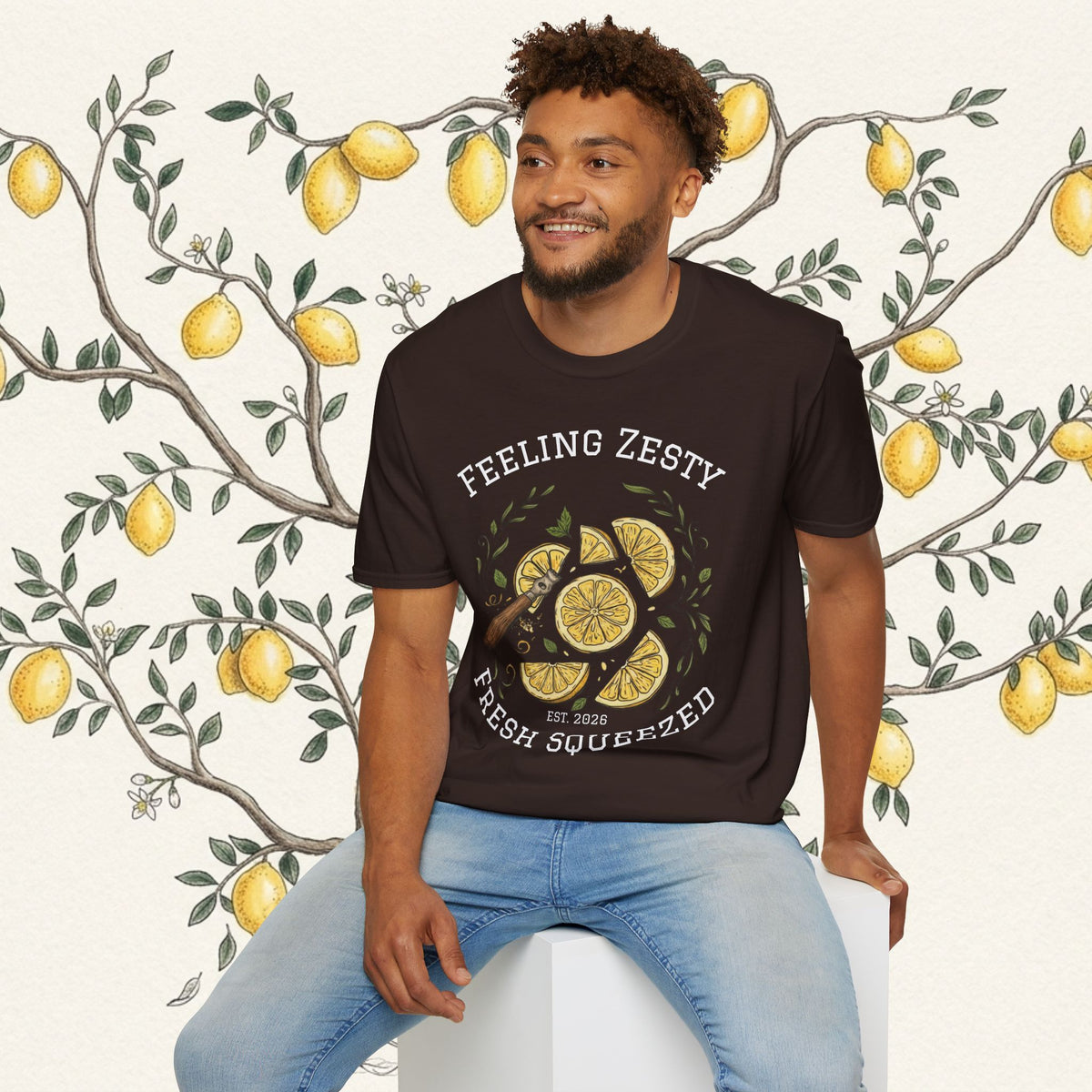 Dark brown graphic t-shirt with lemon slice print and 'Feeling Zesty' lettering, front.