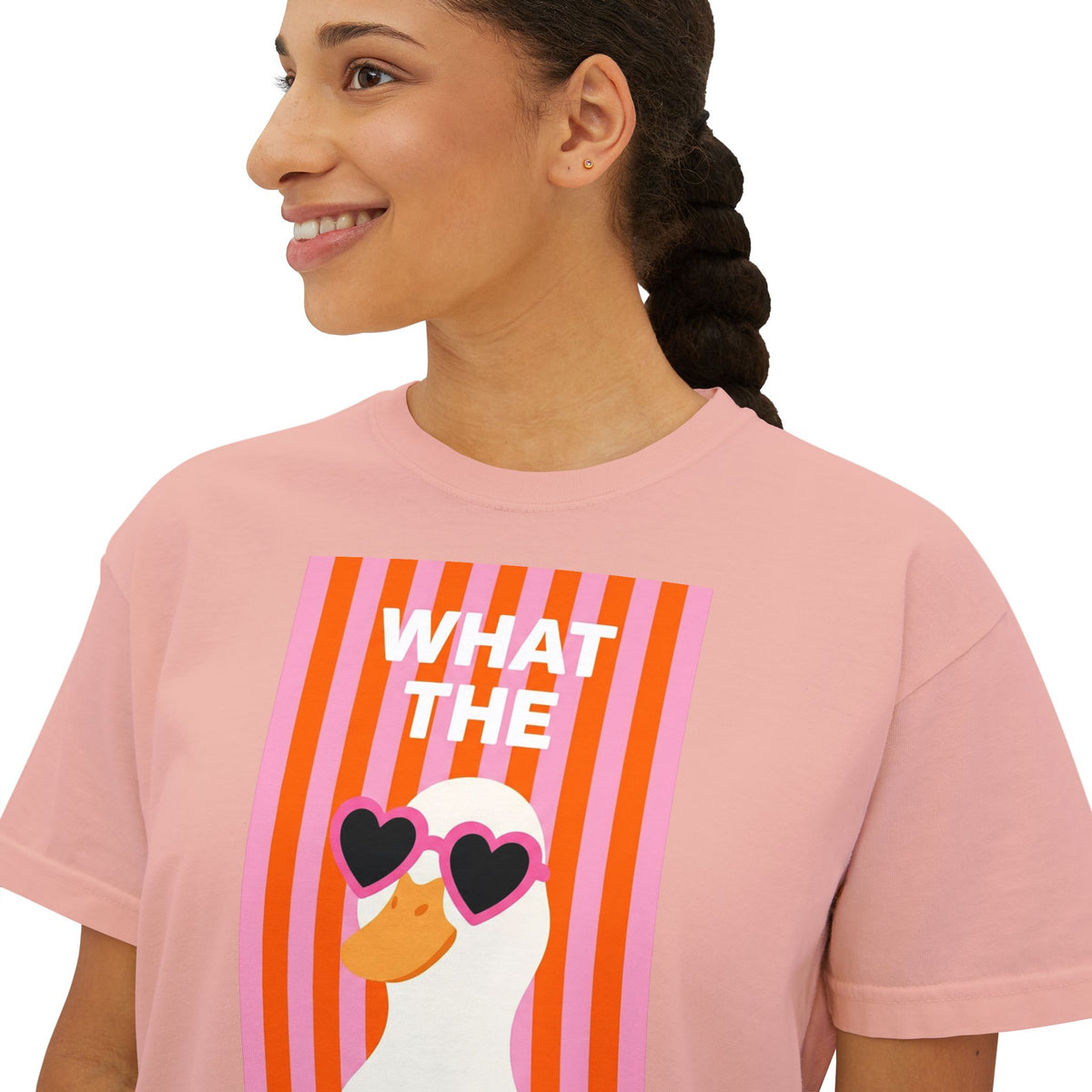 Pink crew-neck graphic tee with “WHAT THE” text and duck wearing heart glasses