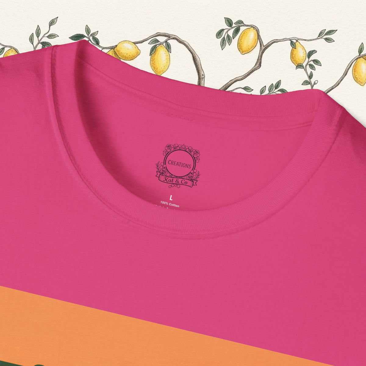 Pink crewneck t-shirt close-up of neckline with small chest logo