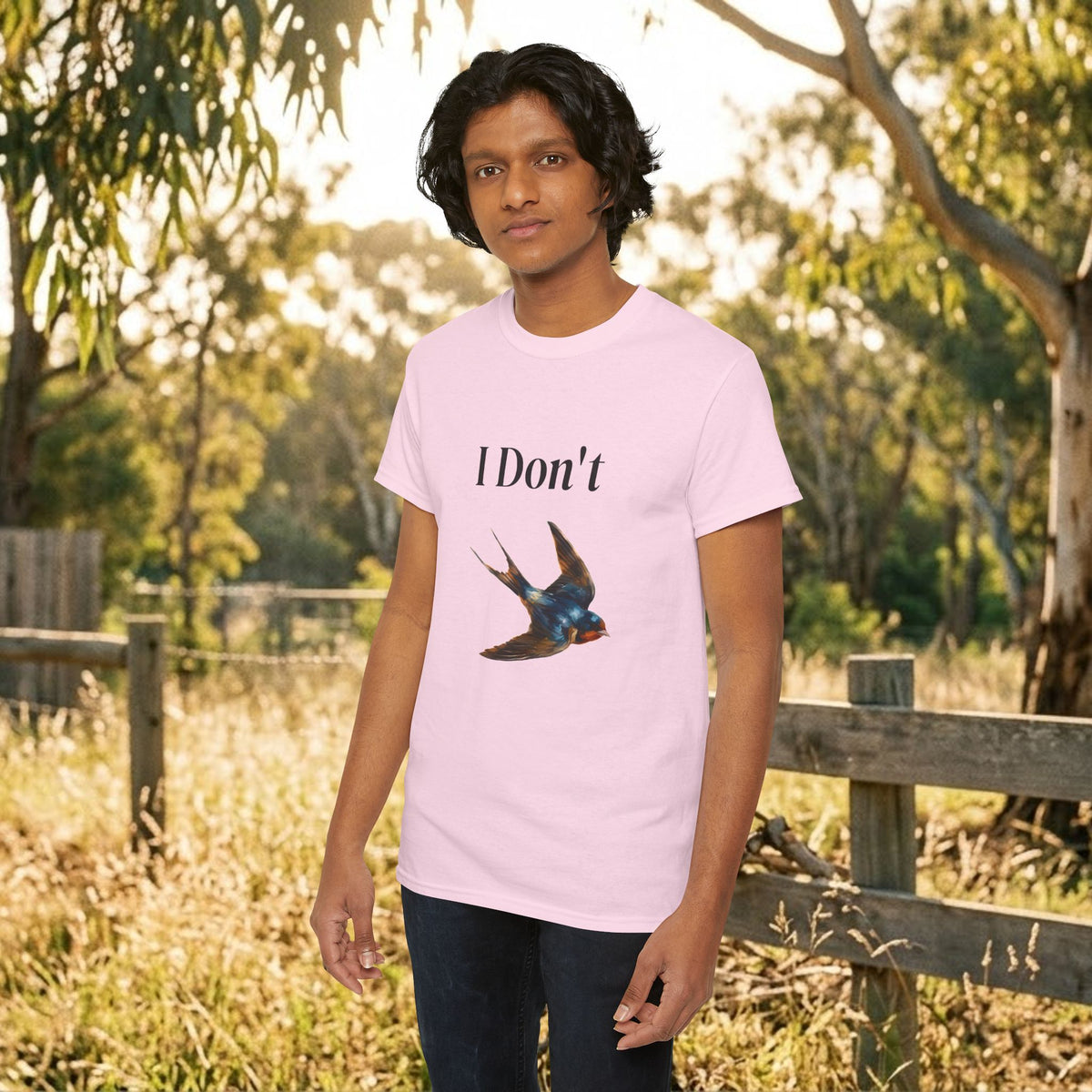 Light pink graphic T-shirt with “I Don’t” text and bird illustration on the chest
