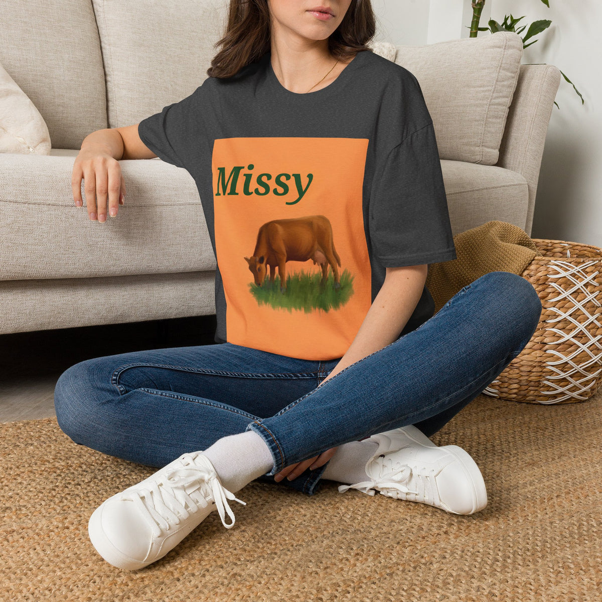 Charcoal T-shirt with orange “Missy” graphic panel and grazing cow illustration