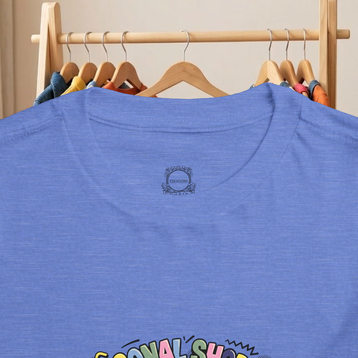 Toddler blue t-shirt close-up of back neckline logo and partial shopping cart print