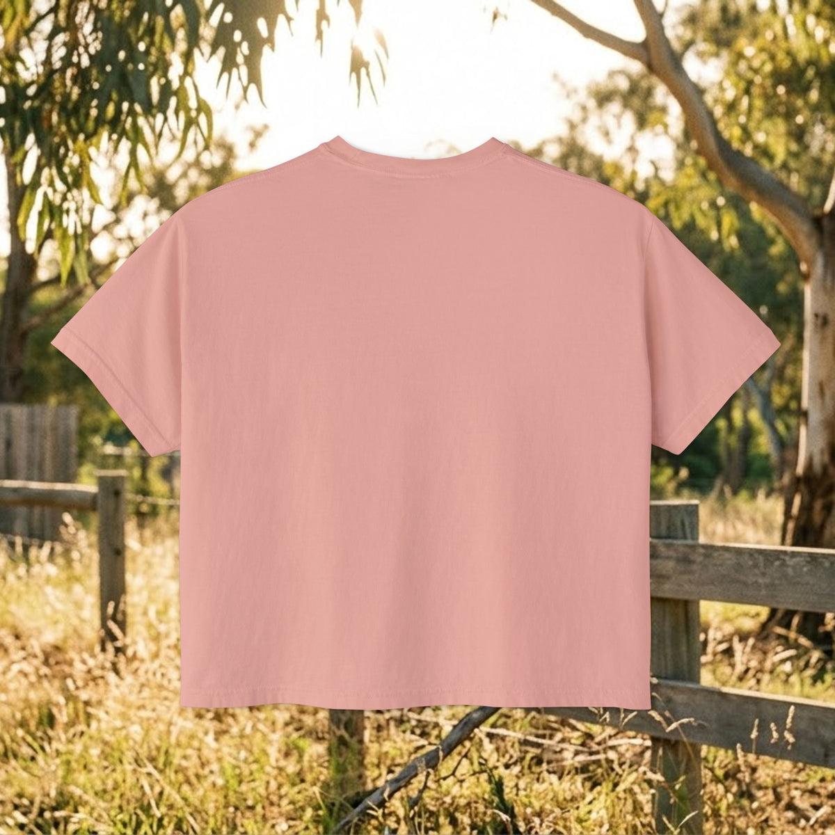 Women’s boxy tee in peach pink, plain back with crew neck and short sleeves.