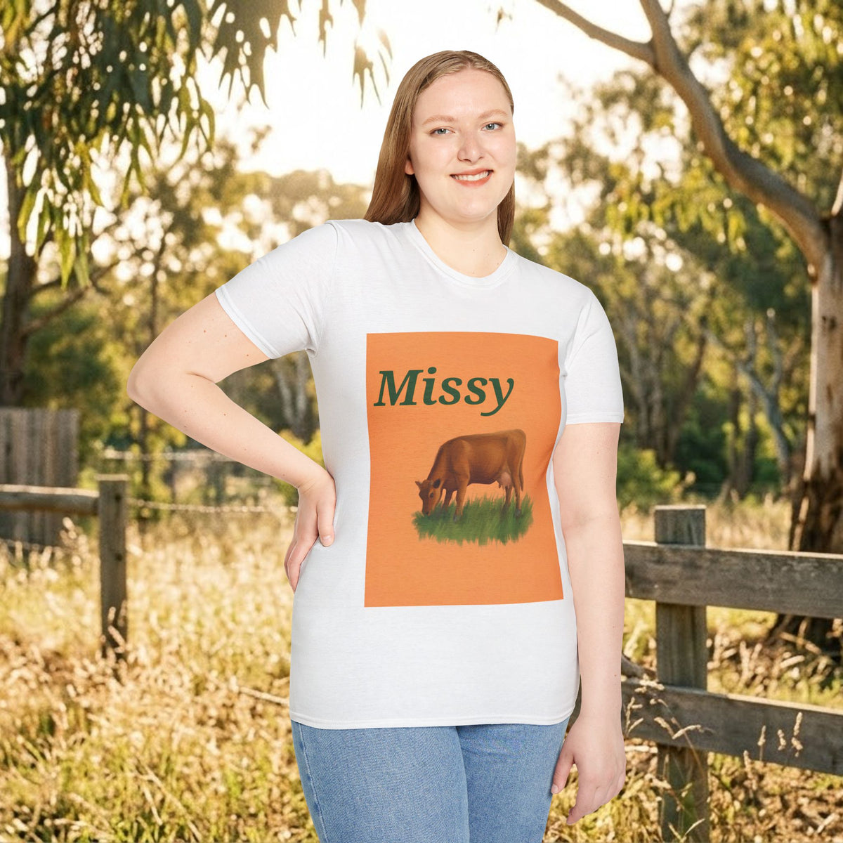 White cow graphic t-shirt with 'Missy' and grazing cow artwork, side pose