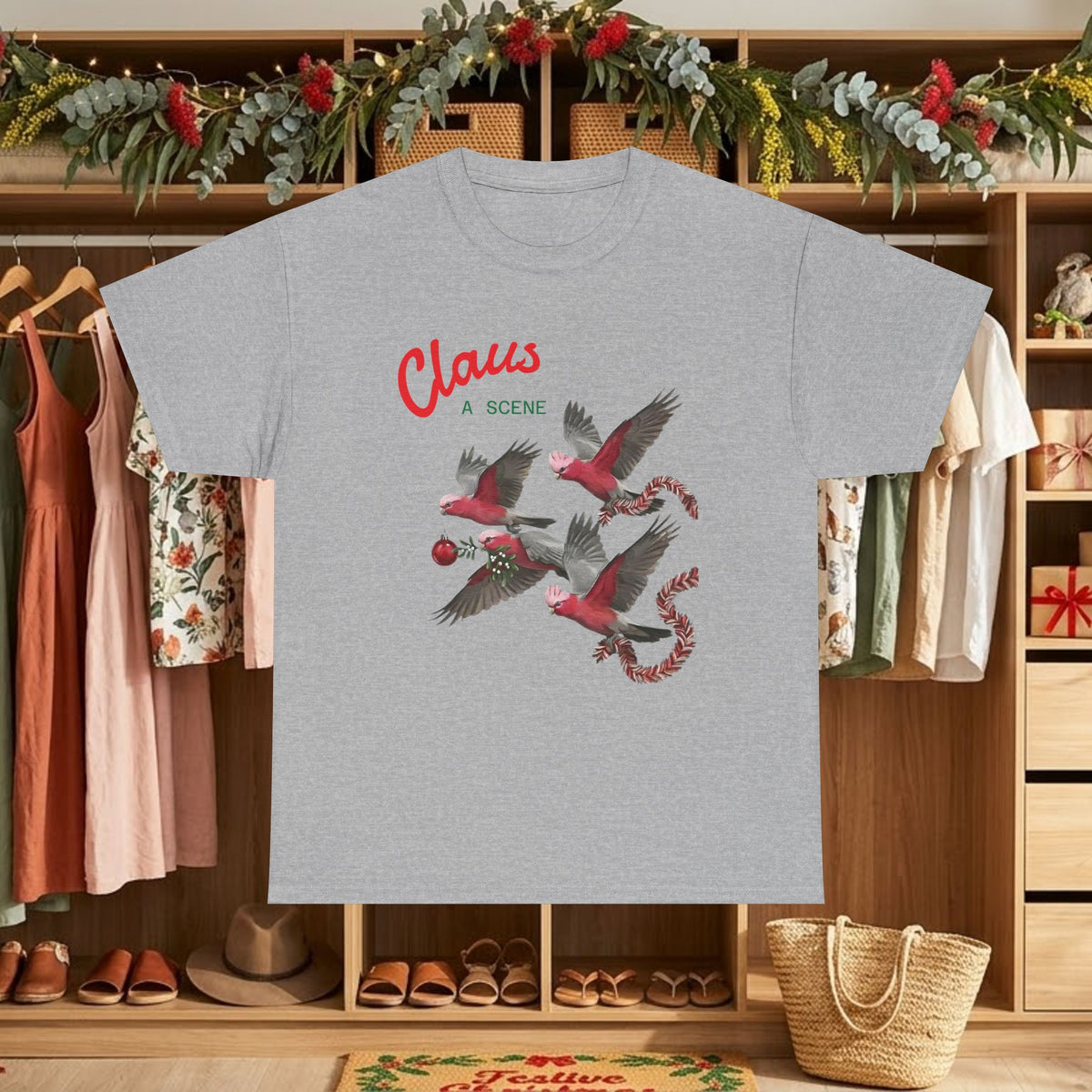 Charcoal Christmas graphic tee with “Claus” text and red flying bird scene