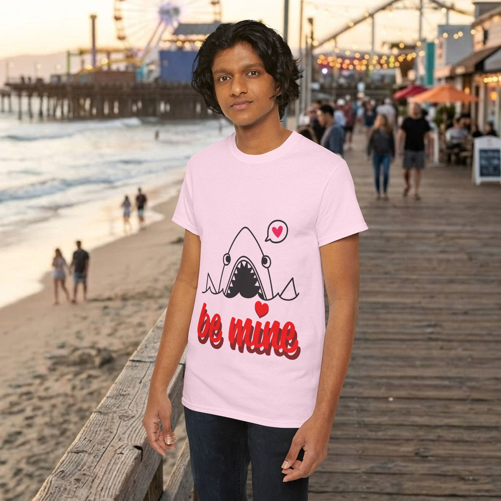 Light pink T-shirt with cartoon shark and red “be mine” graphic on the chest