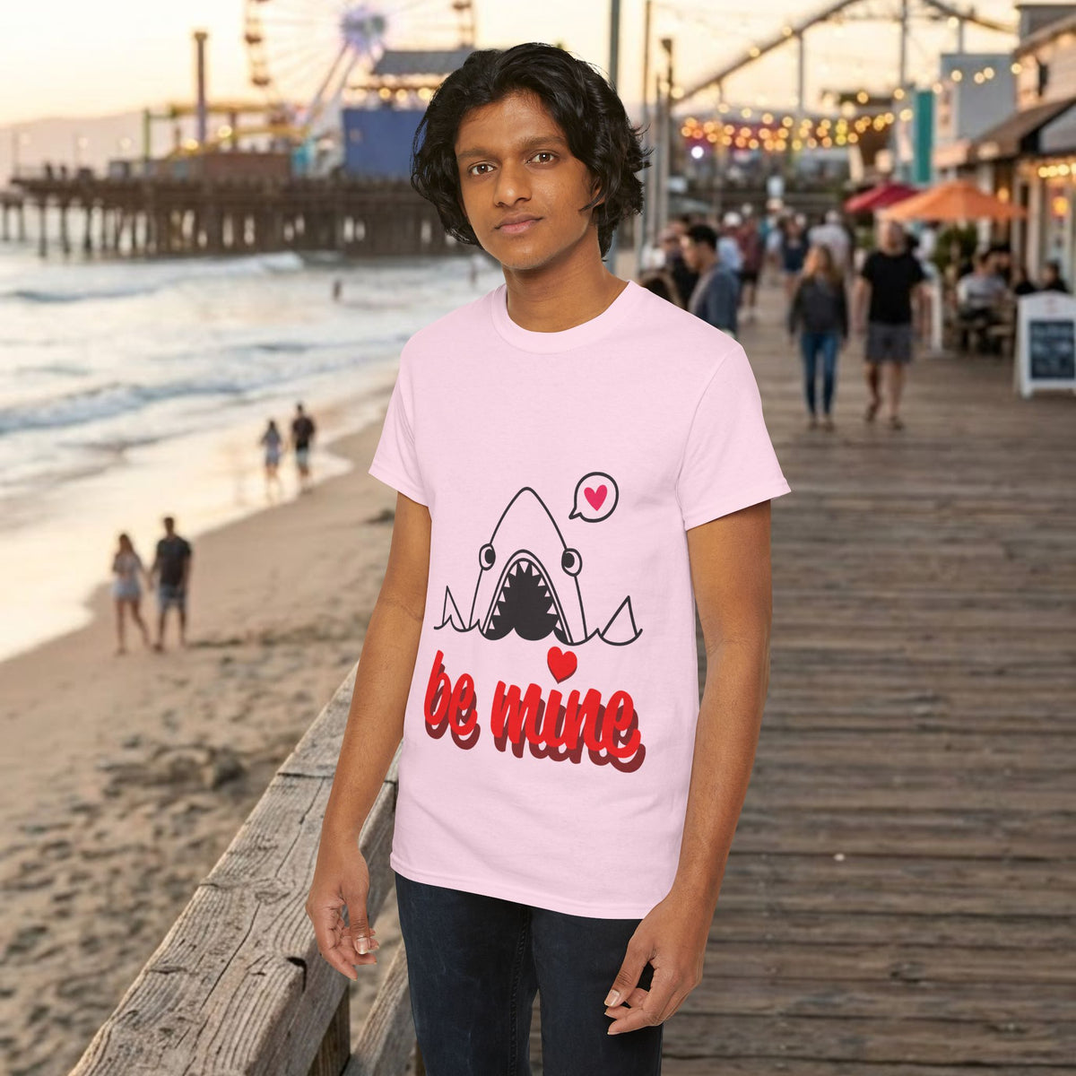 Light pink T-shirt with cartoon shark and red “be mine” graphic on the chest