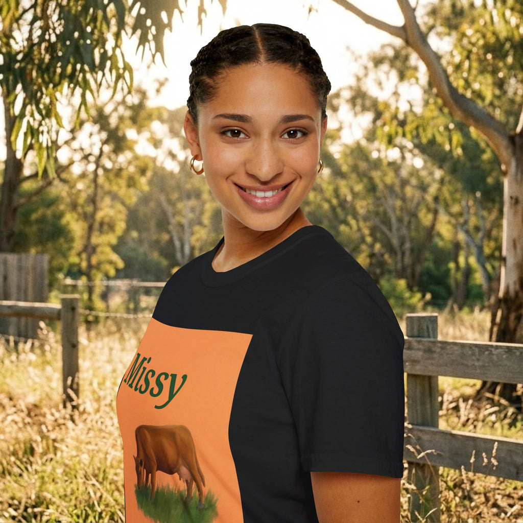 Black cow graphic T-shirt with orange 'Missy' square and grazing cow