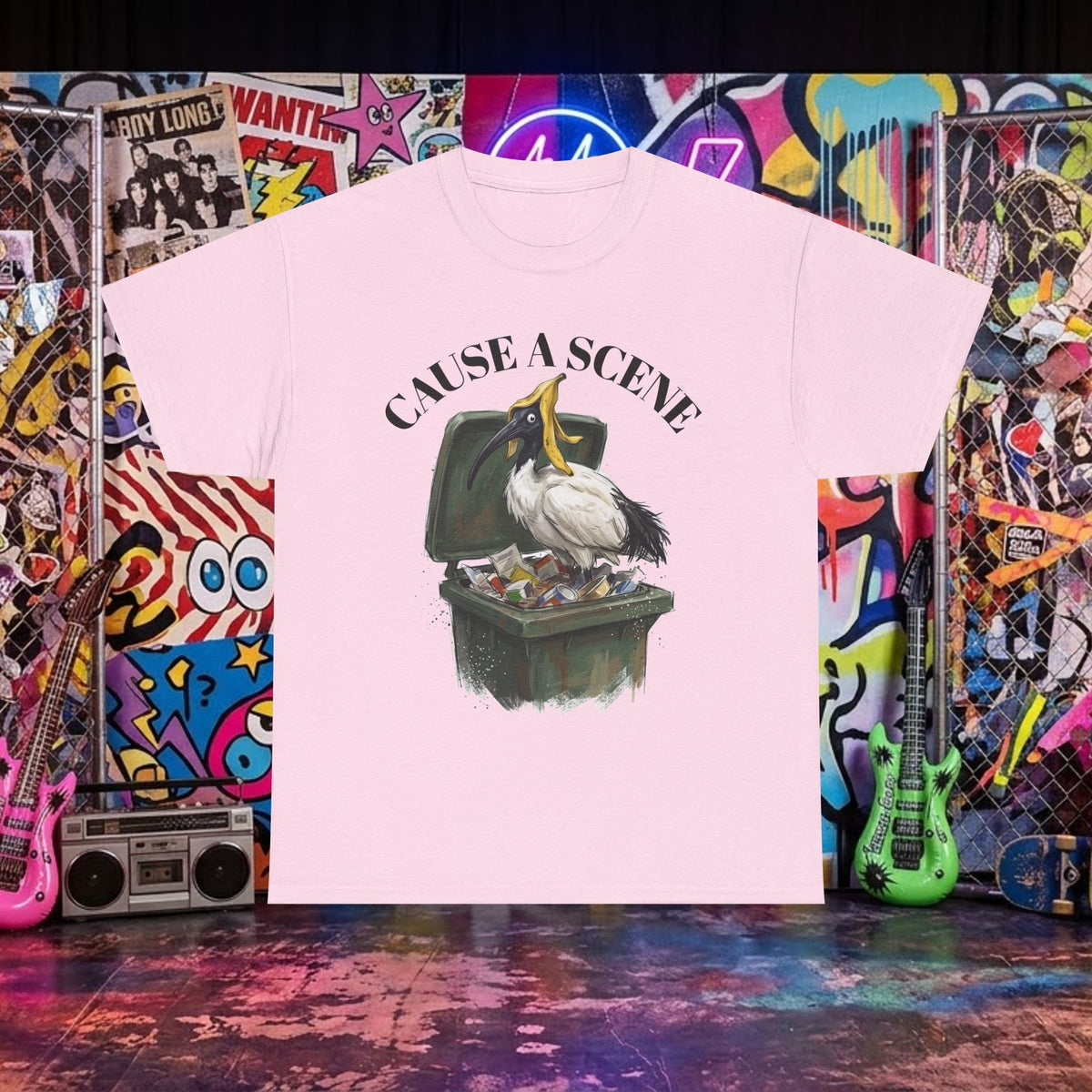 Light pink T-shirt with ibis in a trash can graphic and "CAUSE A SCENE" text