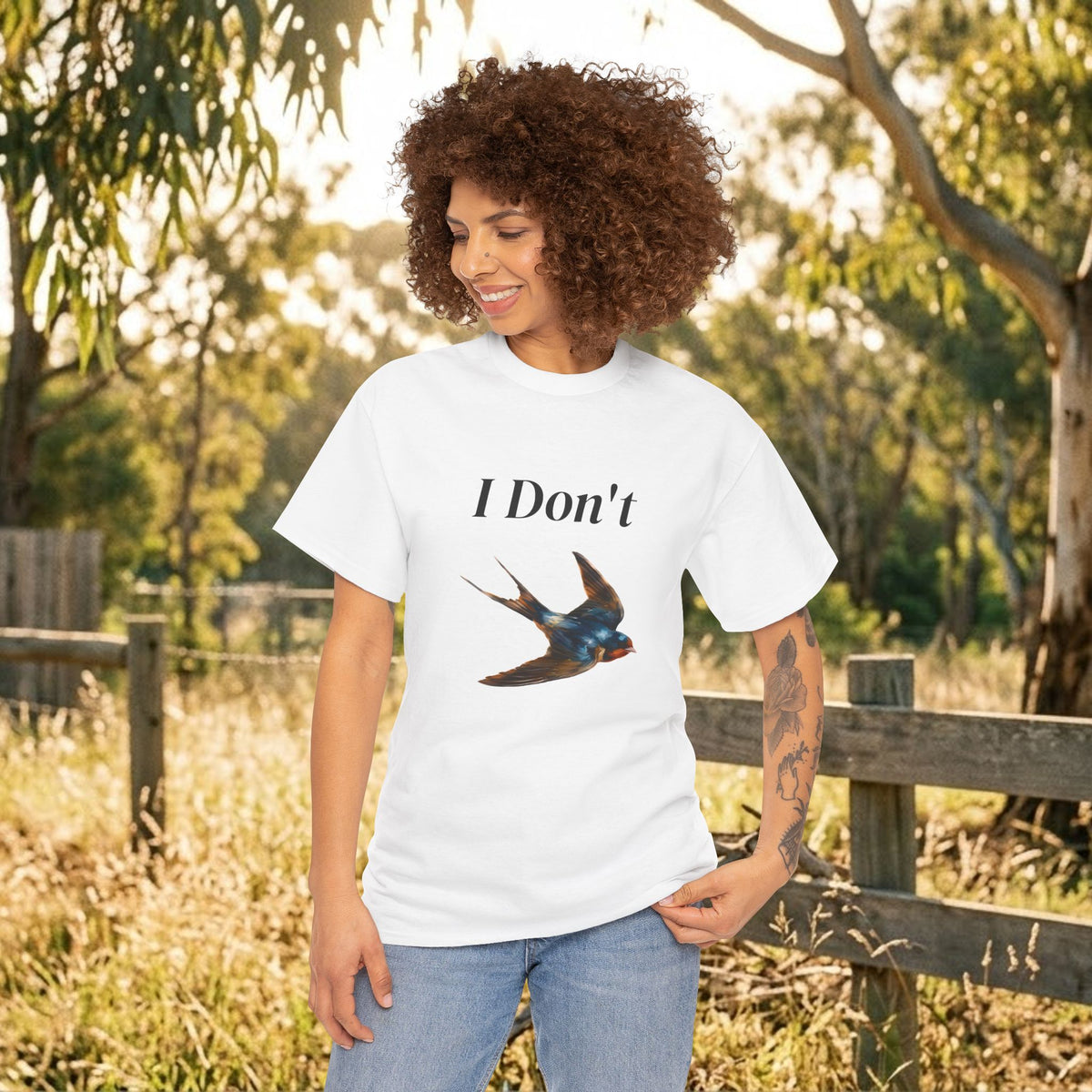 White graphic T-shirt with “I Don’t” text and bird illustration, short-sleeve crew neck