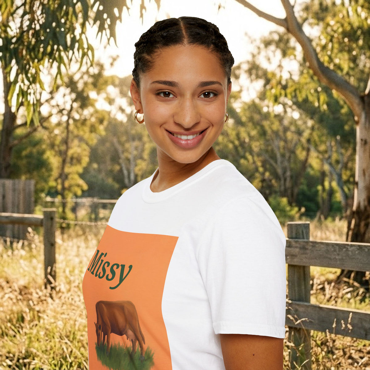 White cow graphic t-shirt with 'Missy' text and grazing cow artwork, angled close-up