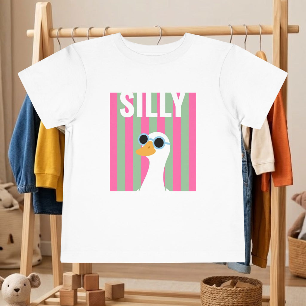 White toddler graphic tee with pink 'SILLY' duck sunglasses square front print