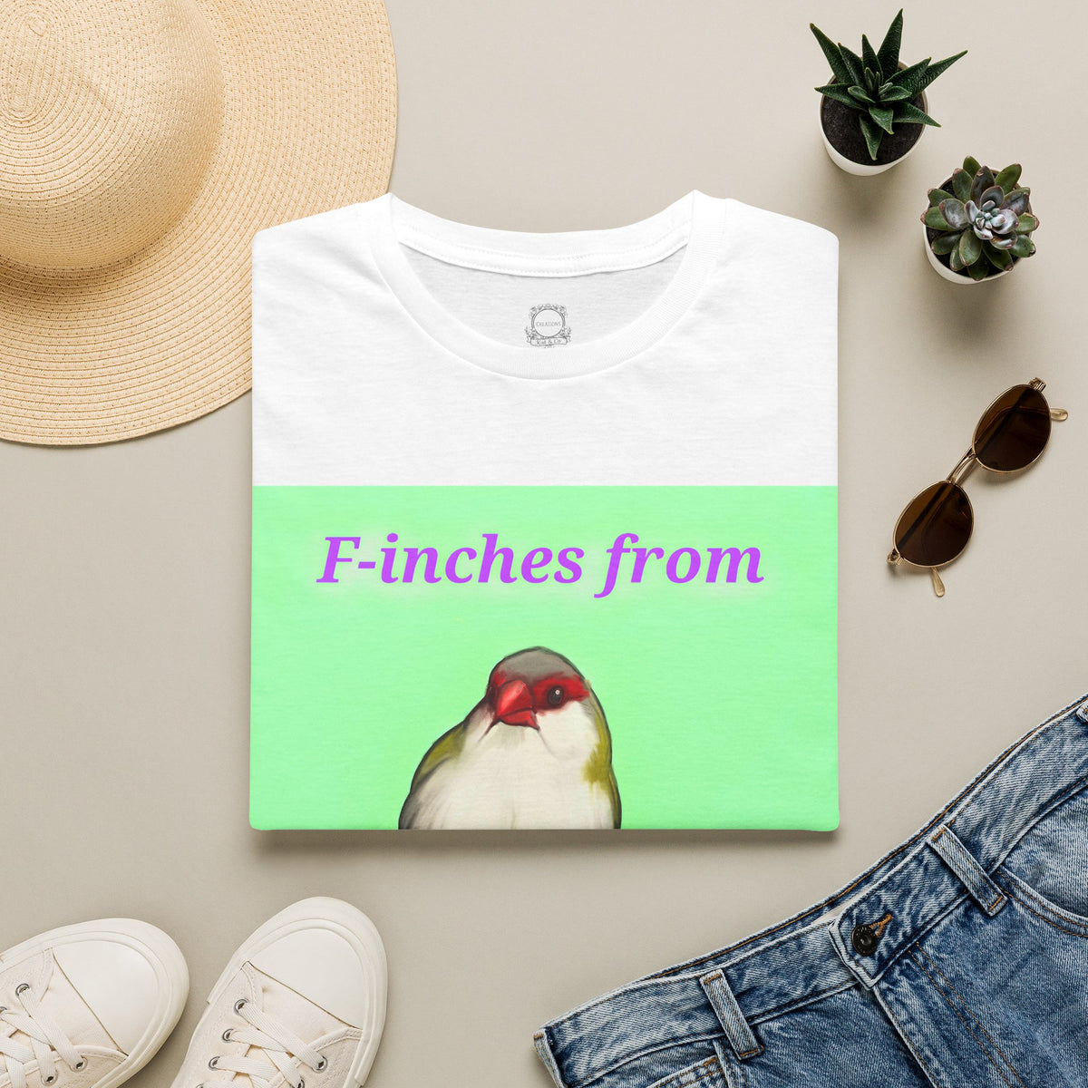 White t-shirt with green graphic panel and cute bird illustration print