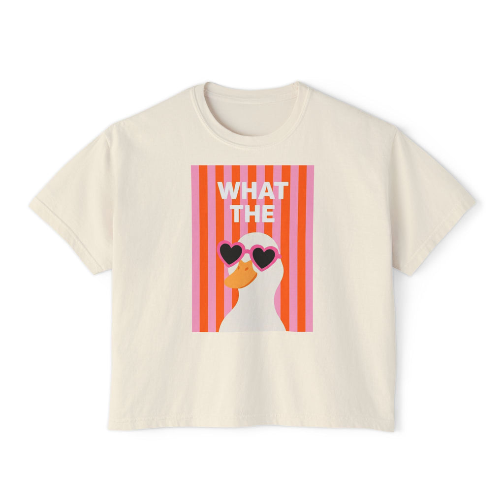 Ivory short-sleeve graphic tee with “WHAT THE” text and duck with heart glasses