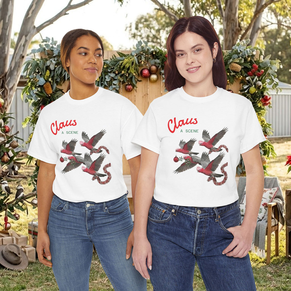 White Christmas graphic tee on two models, “Claus” text and red flying bird scene