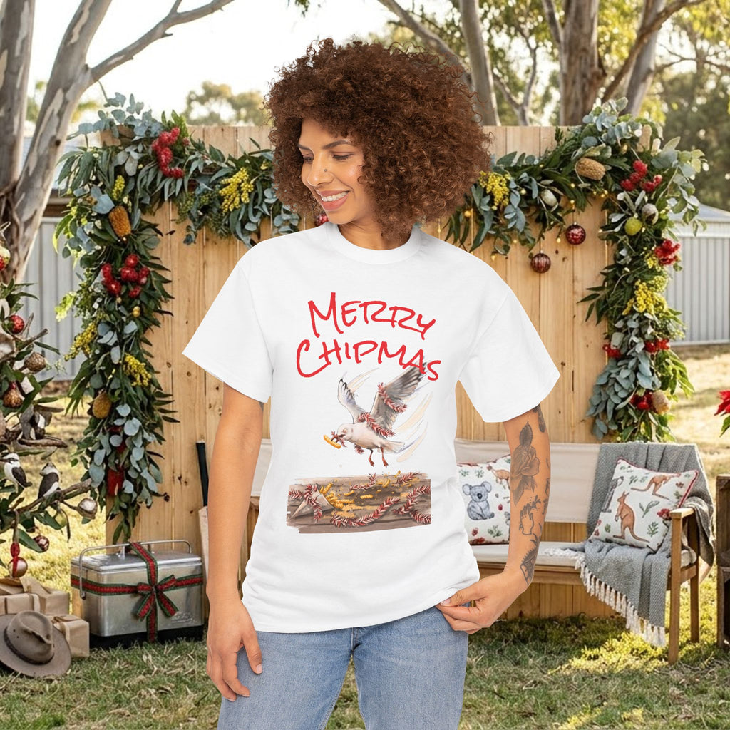 White holiday tee with red “Merry Chipmas” seagull illustration and gift box graphic