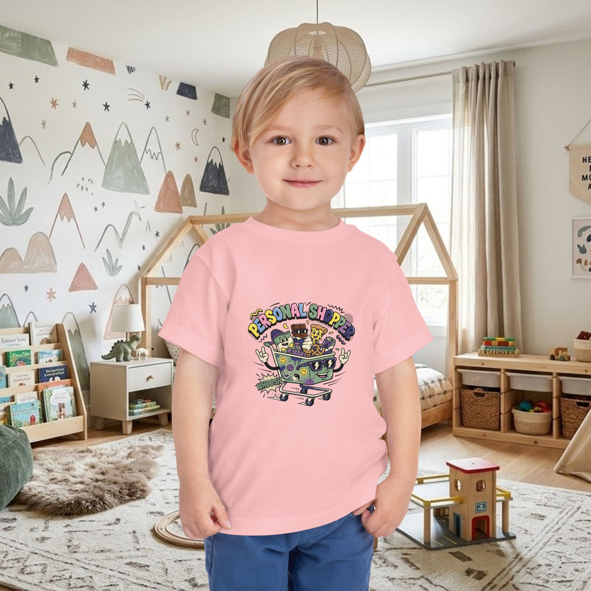Pink toddler T-shirt with colorful shopping cart graphic on front
