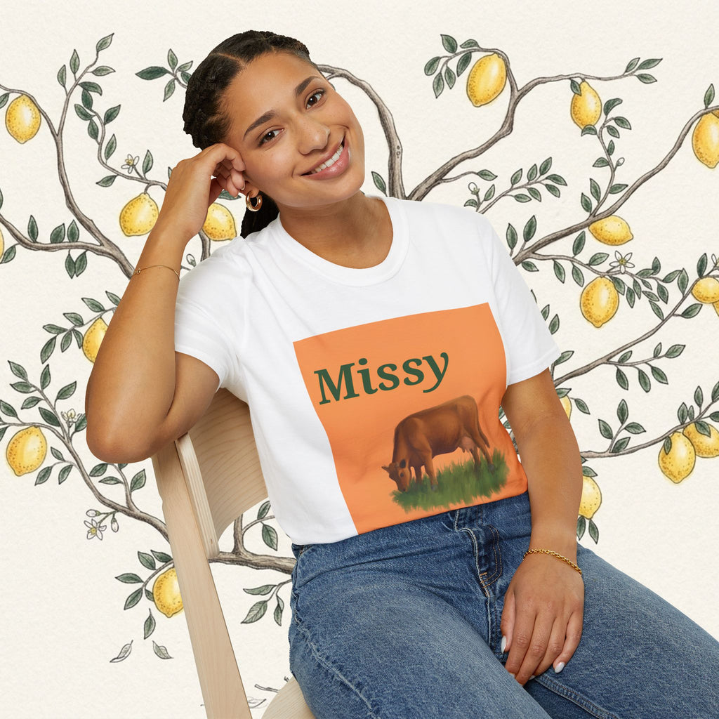 White cow graphic t-shirt with centered 'Missy' and grazing cow illustration