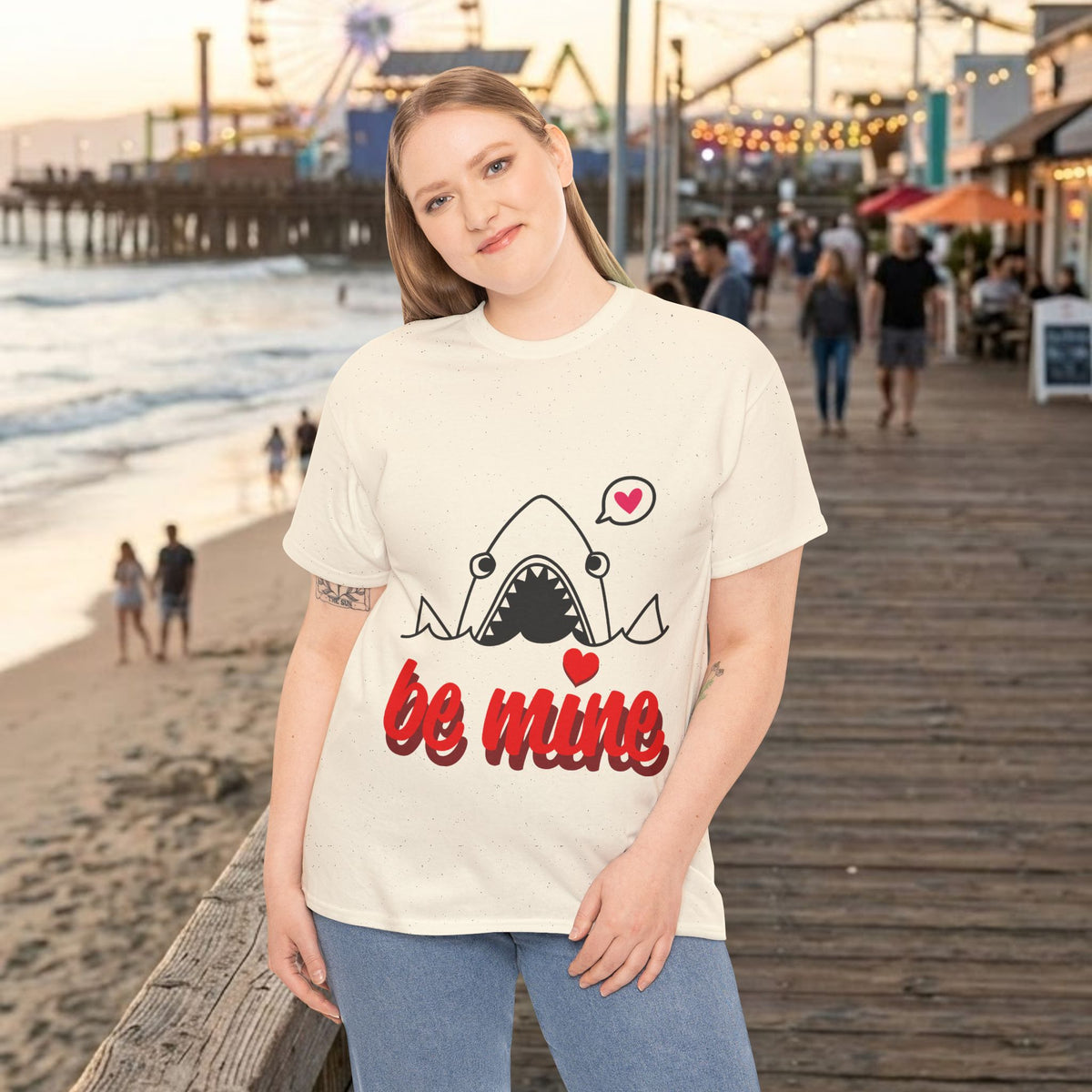 Cream T-shirt with shark graphic and red 'be mine' script with heart accents.