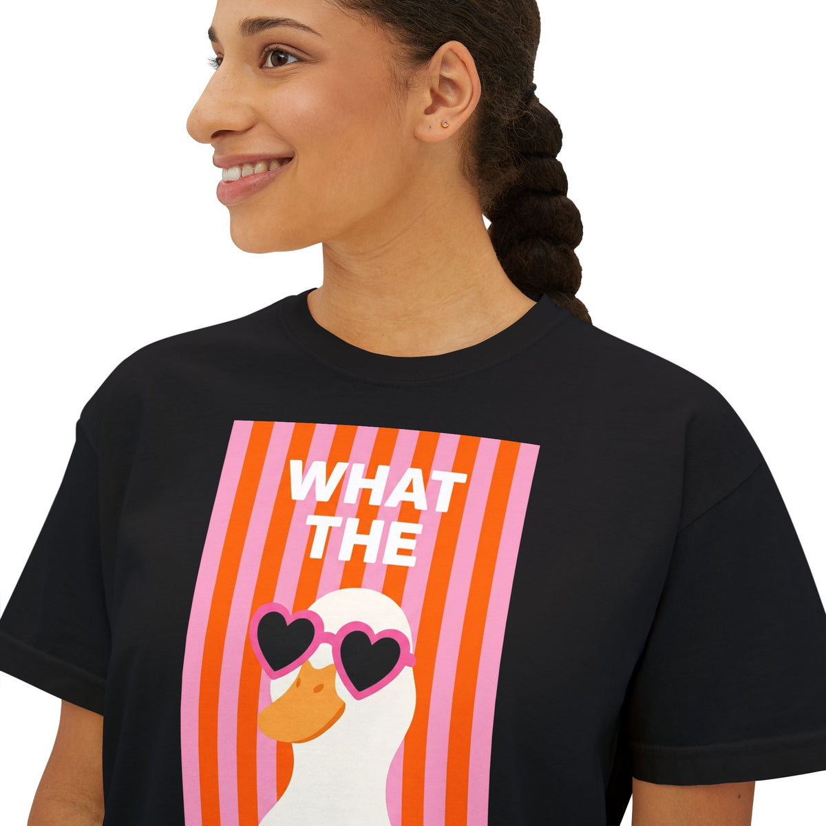 Black crew-neck graphic tee with “WHAT THE” text and duck wearing heart glasses