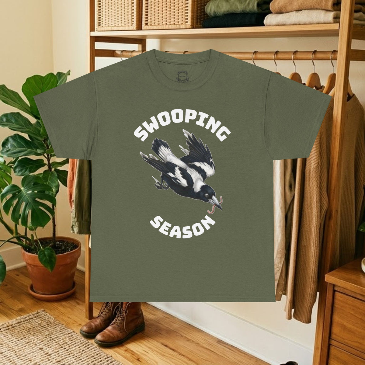 Military green t-shirt with black bird graphic and "SWOOPING SEASON" text