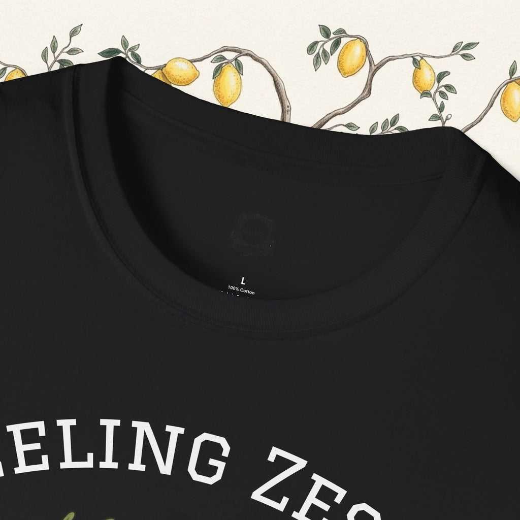 Black crew-neck tee close-up with “FEELING ZESTY” text across the chest