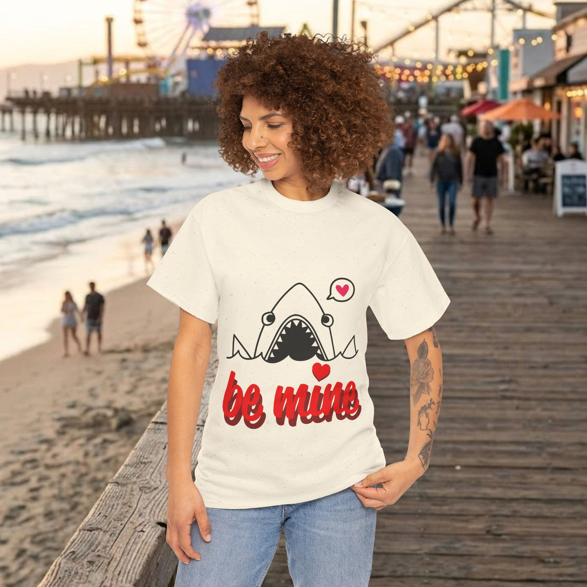 White tee with shark graphic and red 'be mine' text with heart accents.