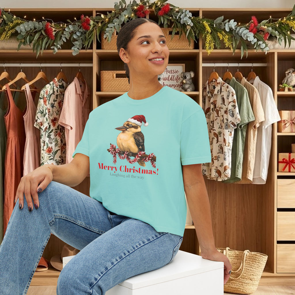 Turquoise Christmas T-shirt with kookaburra Santa hat front graphic, model wearing it