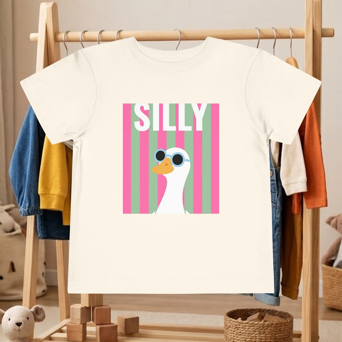 Toddler off-white tee with “SILLY” and duck wearing sunglasses graphic