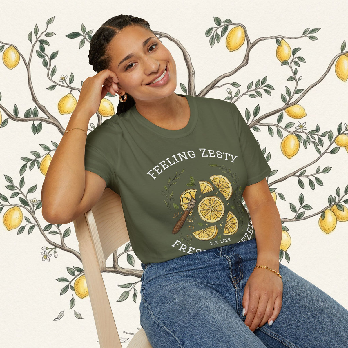 Olive green crewneck graphic tee with “FEELING ZESTY” citrus slice and “FRESH SQUEEZED”