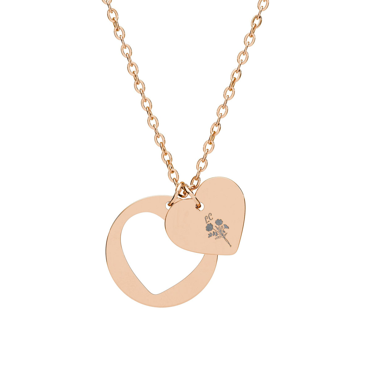Rose gold heart cutout pendant necklace with engraved emblem, linked chain