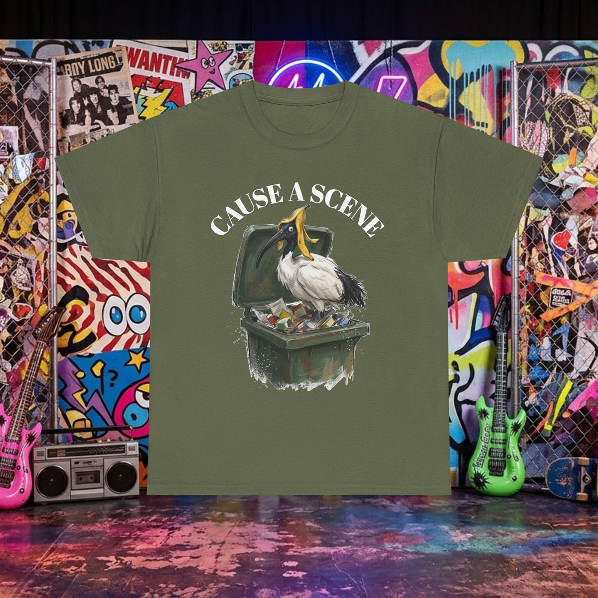 Olive green T-shirt with ibis in a trash can graphic and "CAUSE A SCENE" text