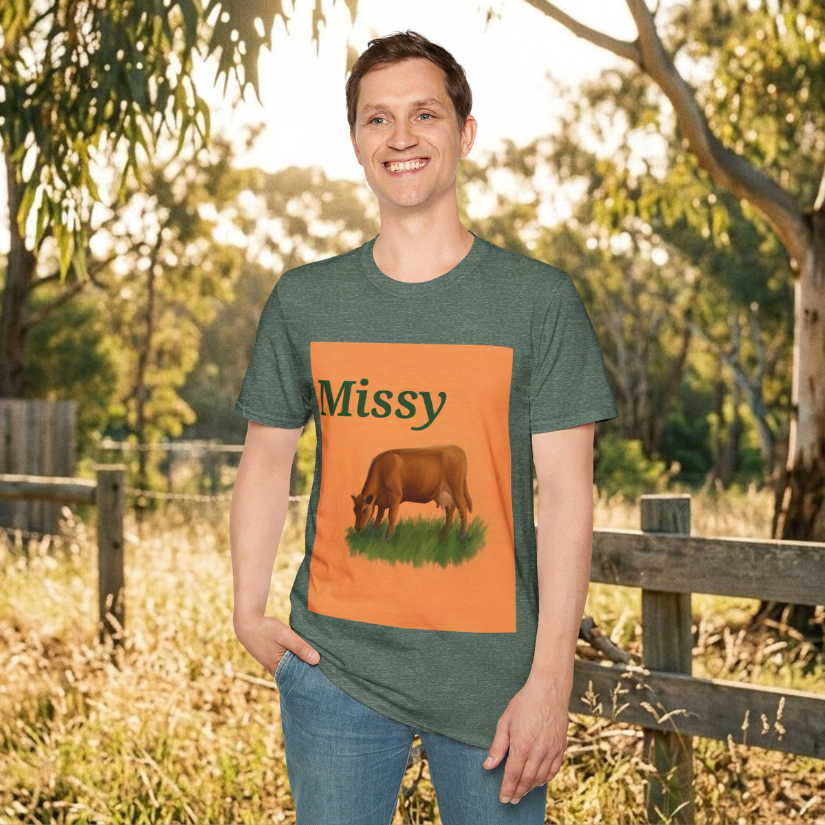 Green crewneck T-shirt featuring orange grazing cow graphic and “Missy”